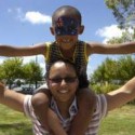Ashton Hermanus flies the Aussie flag with some help from his mum Eldri Esau-Hermanus at last year's Australia Day celebrations in Pakenham. 76354 Picture: LILLY O'GORMAN