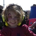 Jessica Foster, from Pakenham, protects her ears from the loud tractors. 92697
