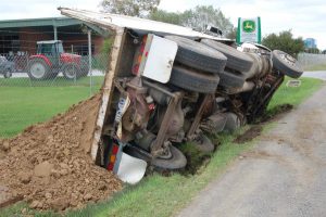 Driver safe after truck tips