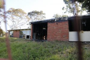 Vacant house burns down