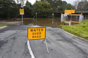 Flood conditions close roads and impact homes
